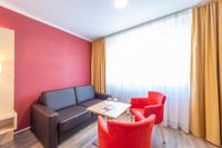 Die Zimmer des Hotel Garni an der Stadthalle sind mit einem Sofa, Couch und Ledersofa ausgestattet